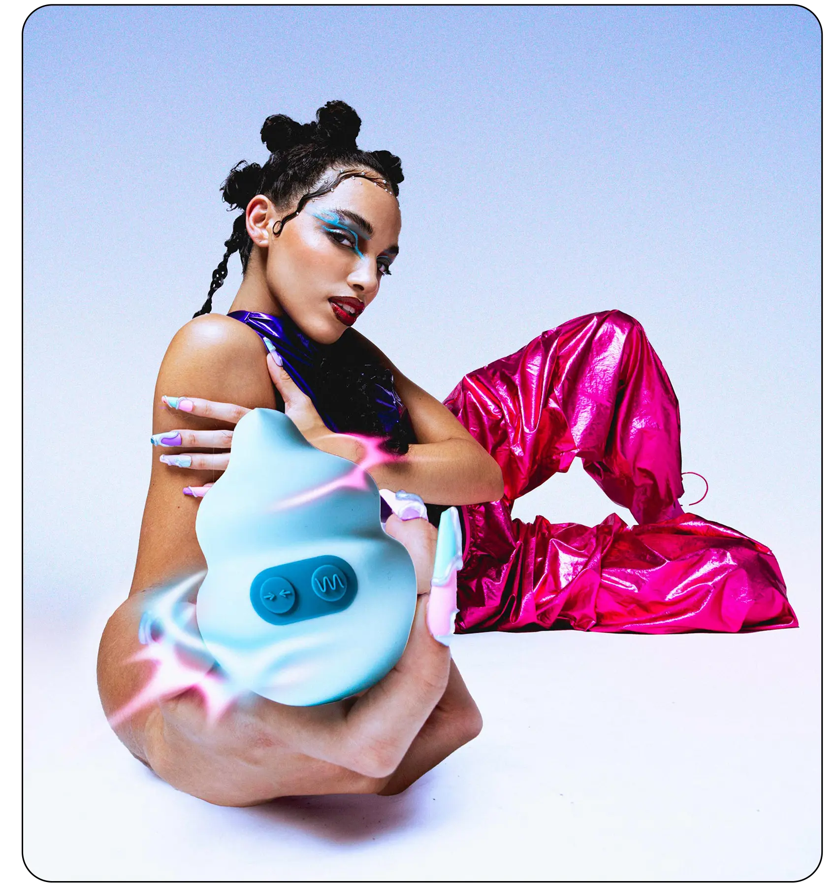 Model holding a sculptural Unbound pleasure product